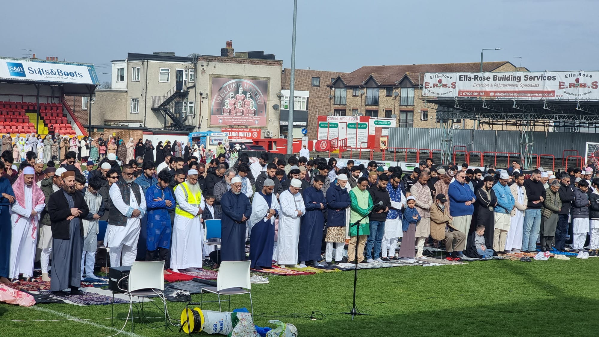 Close rows of the community standing for Eid prayer